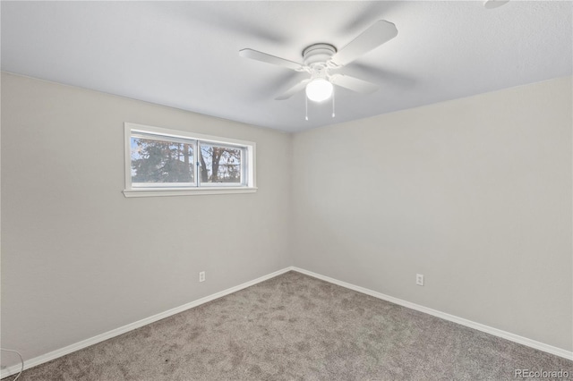 spare room featuring baseboards, carpet floors, and ceiling fan