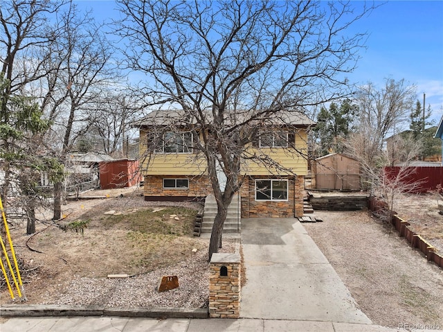view of front of property featuring fence