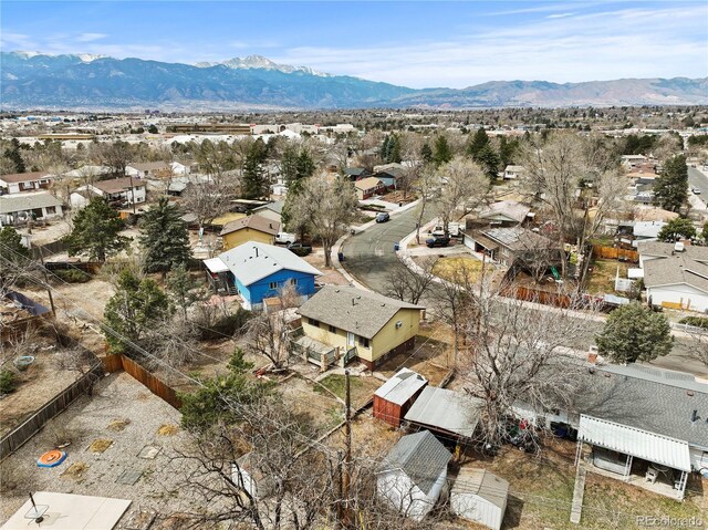 birds eye view of property with a mountain view and a residential view
