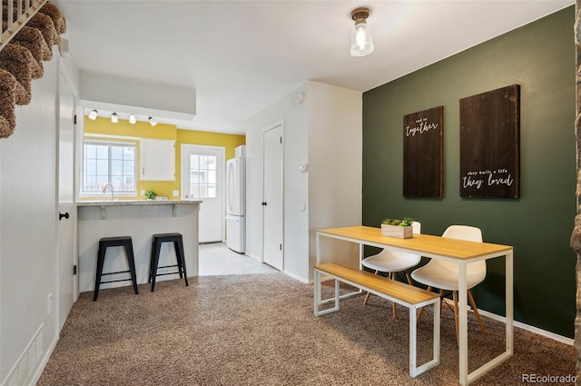 view of carpeted dining room