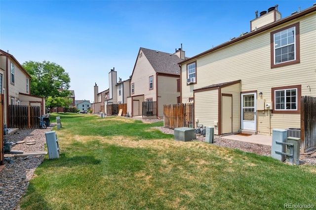 view of yard featuring fence and a residential view