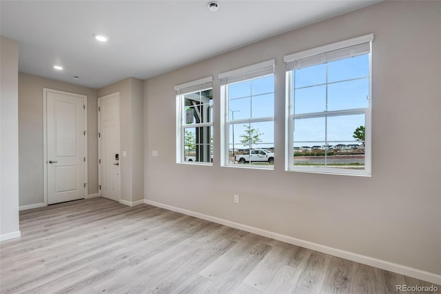 empty room with light wood-type flooring