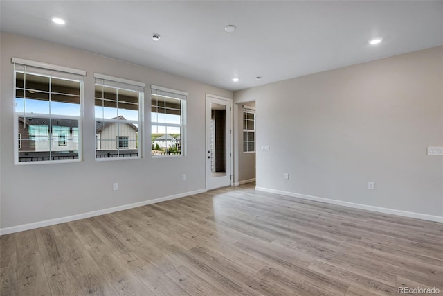 unfurnished room featuring light hardwood / wood-style flooring