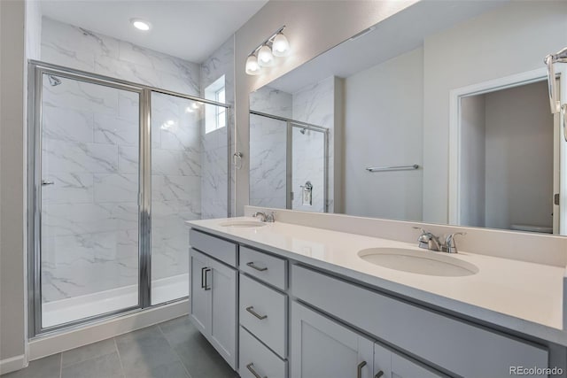 bathroom featuring tile patterned floors, vanity, and walk in shower