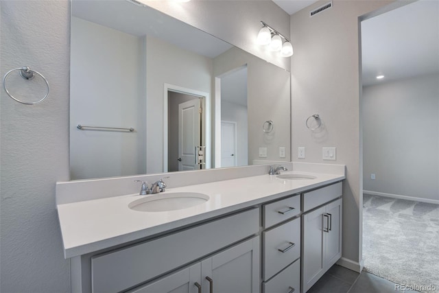 bathroom featuring tile patterned floors and vanity