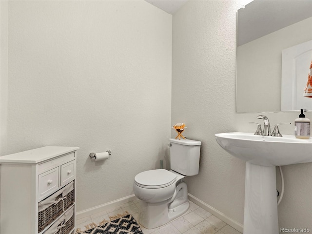 28314 E 6th Pl, Watkins, CO 80137 - bathroom with toilet and baseboards