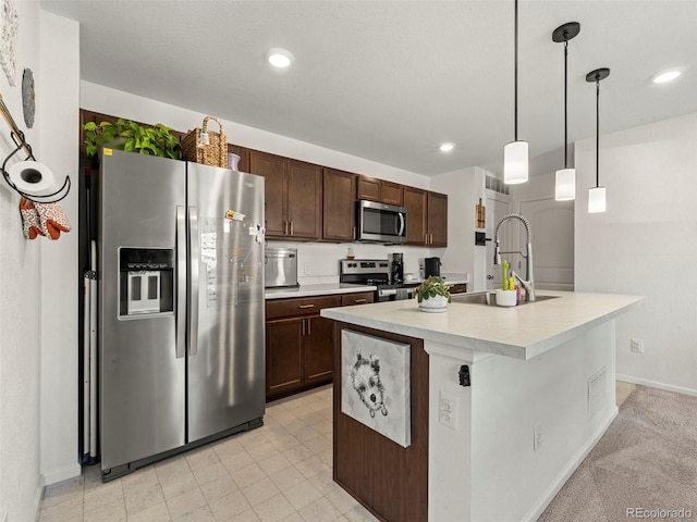 28314 E 6th Pl, Watkins, CO 80137 - kitchen with appliances with stainless steel finishes, a sink, light countertops, dark brown cabinetry, and pendant lighting