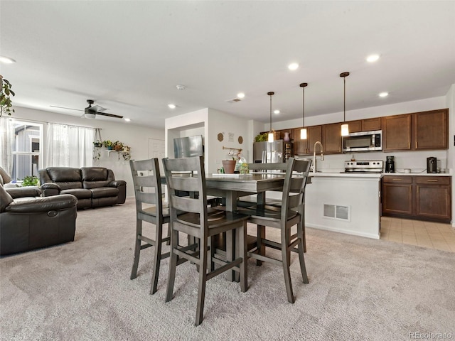 28314 E 6th Pl, Watkins, CO 80137 - dining area featuring light colored carpet, recessed lighting, and a ceiling fan