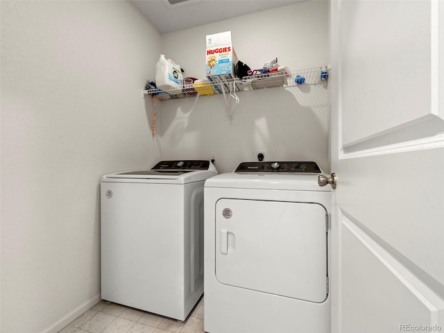 28314 E 6th Pl, Watkins, CO 80137 - laundry area featuring washer and clothes dryer and baseboards