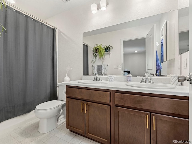 28314 E 6th Pl, Watkins, CO 80137 - full bath featuring double vanity, toilet, a shower with curtain, and tile patterned floors