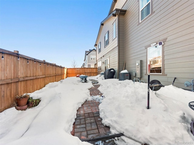 28314 E 6th Pl, Watkins, CO 80137 - yard covered in snow with a fenced backyard and central AC unit