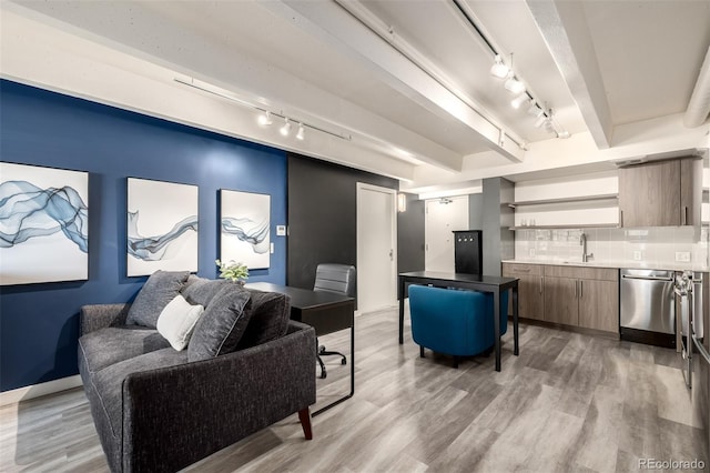 1495 Vrain St Unit 110, Denver, CO 80204 - living room with track lighting and light wood finished floors