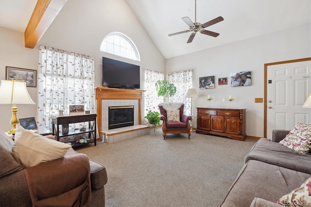 living room featuring high vaulted ceiling, ceiling fan, carpet floors, and a fireplace
