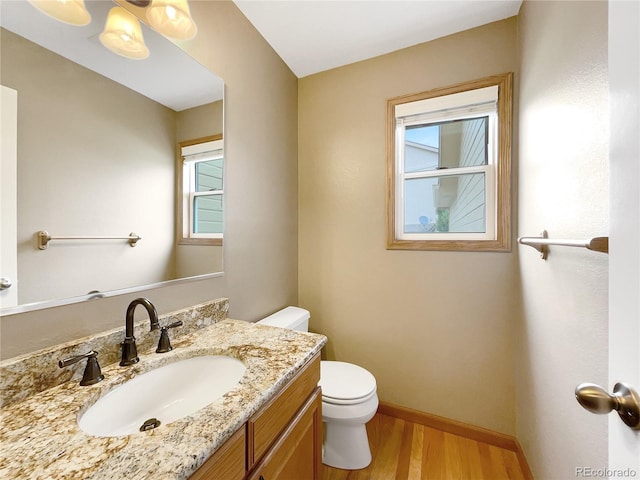 642 52nd Ave, Greeley, CO 80634 - bathroom with wood finished floors and vanity