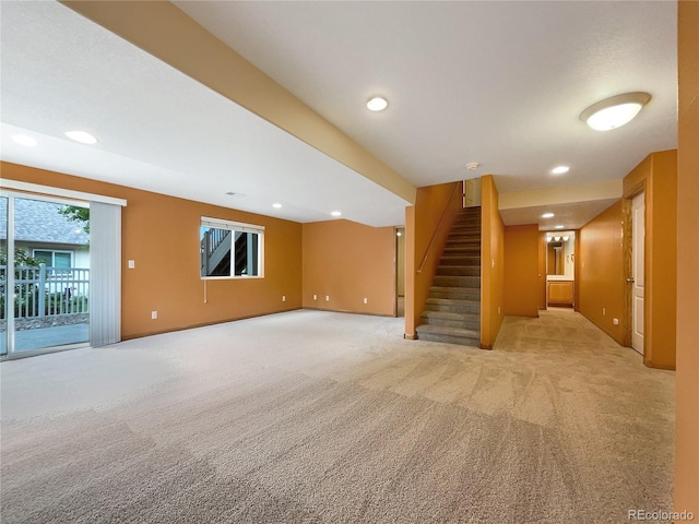 642 52nd Ave, Greeley, CO 80634 - unfurnished living room featuring light carpet, stairway, and recessed lighting
