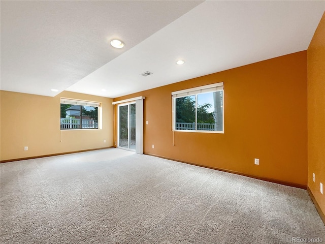 642 52nd Ave, Greeley, CO 80634 - unfurnished room featuring carpet flooring, plenty of natural light, and recessed lighting
