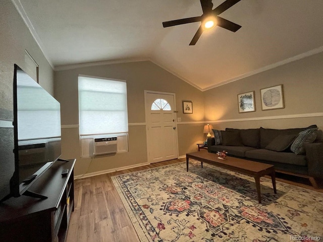 living room with ceiling fan, crown molding, cooling unit, wood-type flooring, and vaulted ceiling