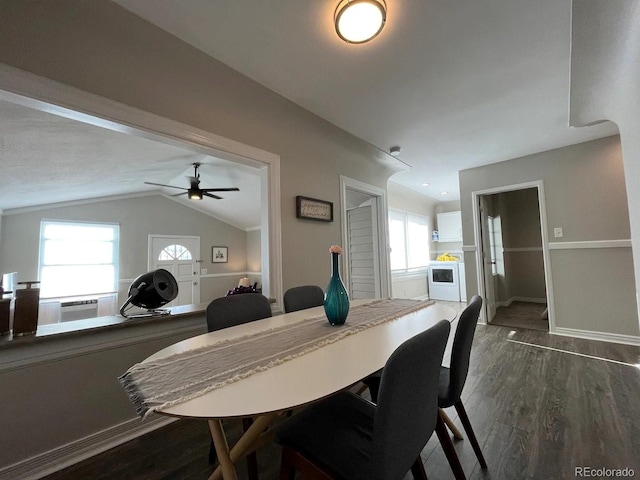 dining area featuring ceiling fan, dark hardwood / wood-style floors, and vaulted ceiling