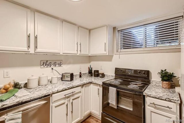 kitchen featuring white cabinets, dishwasher, light stone counters, and black range with electric cooktop