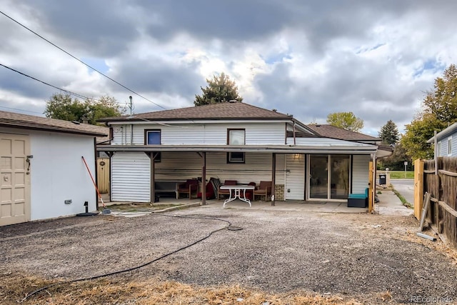 rear view of house with a patio