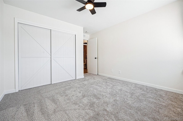 unfurnished bedroom featuring carpet floors, ceiling fan, and a closet