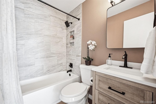 full bathroom featuring vanity, shower / bath combination with curtain, and toilet