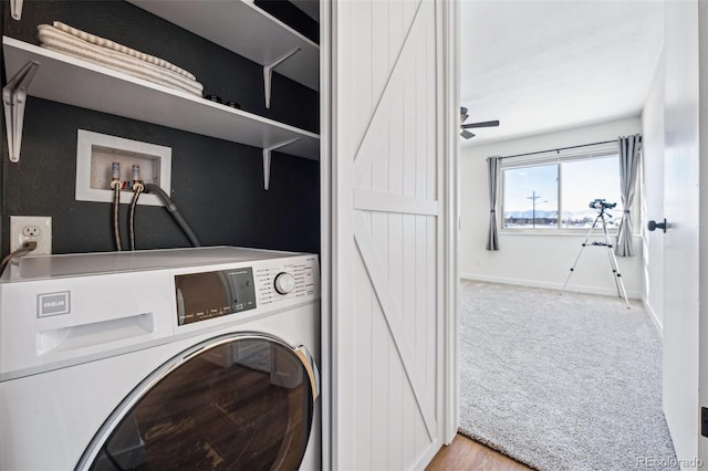 washroom featuring washer / clothes dryer and light colored carpet