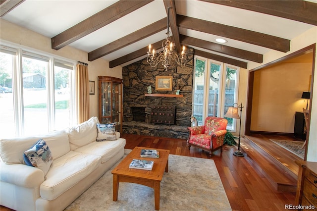 8664 E Monmouth Pl, Denver, CO 80237 - living room with a chandelier, wood-type flooring, a stone fireplace, and recessed lighting