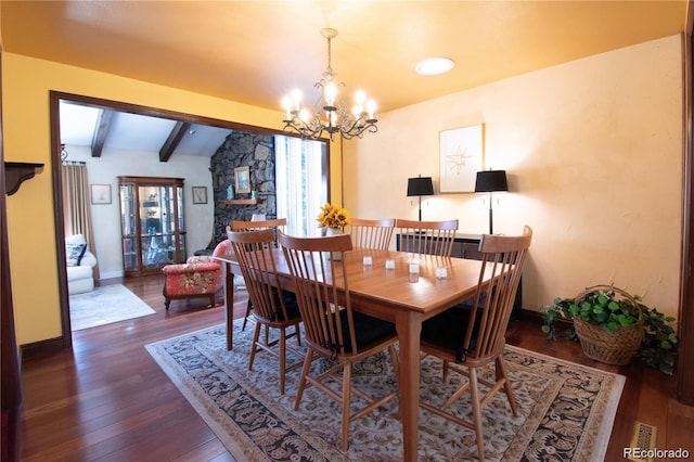 8664 E Monmouth Pl, Denver, CO 80237 - dining room featuring a chandelier and wood finished floors