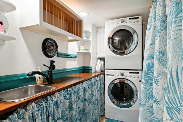 8664 E Monmouth Pl, Denver, CO 80237 - laundry area with stacked washer / dryer