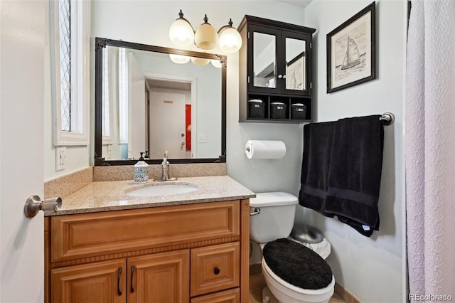 8664 E Monmouth Pl, Denver, CO 80237 - bathroom featuring toilet and vanity