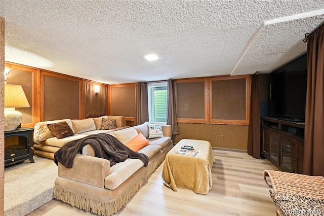 8664 E Monmouth Pl, Denver, CO 80237 - living area with light wood finished floors and a textured ceiling