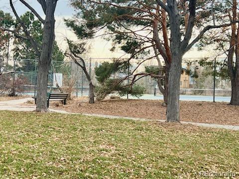 view of yard featuring tennis court