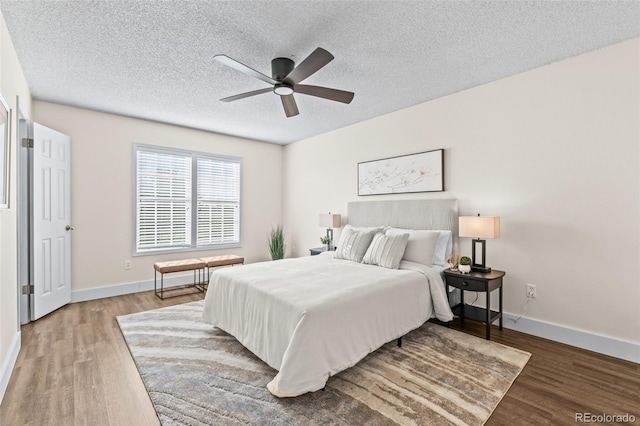 4512 S Yank St, Morrison, CO 80465 - bedroom with wood finished floors, a textured ceiling, and a ceiling fan