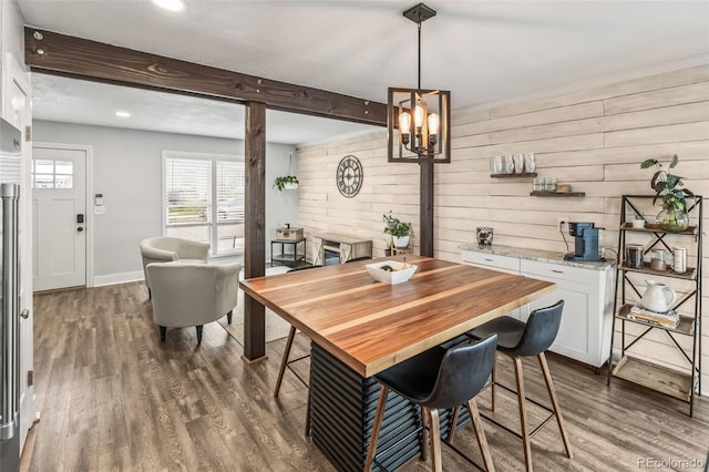 4512 S Yank St, Morrison, CO 80465 - dining room with dark wood-style flooring, recessed lighting, a chandelier, beam ceiling, and wood walls