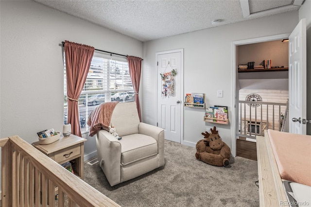 4512 S Yank St, Morrison, CO 80465 - living area with carpet floors, a textured ceiling, and attic access