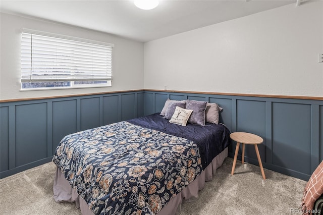 4512 S Yank St, Morrison, CO 80465 - carpeted bedroom with a decorative wall and wainscoting