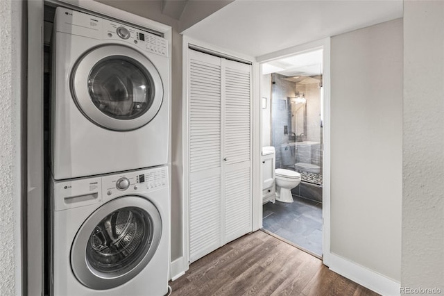 4512 S Yank St, Morrison, CO 80465 - laundry room with estacked washer and dryer and dark wood finished floors