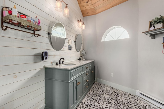 bathroom with wooden ceiling, baseboards, baseboard heating, and a sink