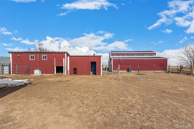 view of pole building featuring fence