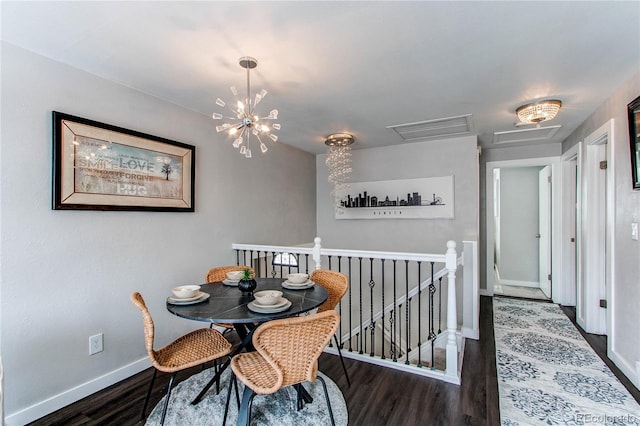 dining area with a notable chandelier and dark hardwood / wood-style floors