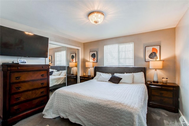 carpeted bedroom featuring a closet