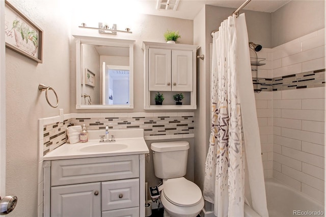 full bathroom featuring tasteful backsplash, vanity, toilet, and shower / bath combo with shower curtain