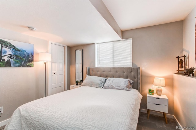 bedroom with dark colored carpet