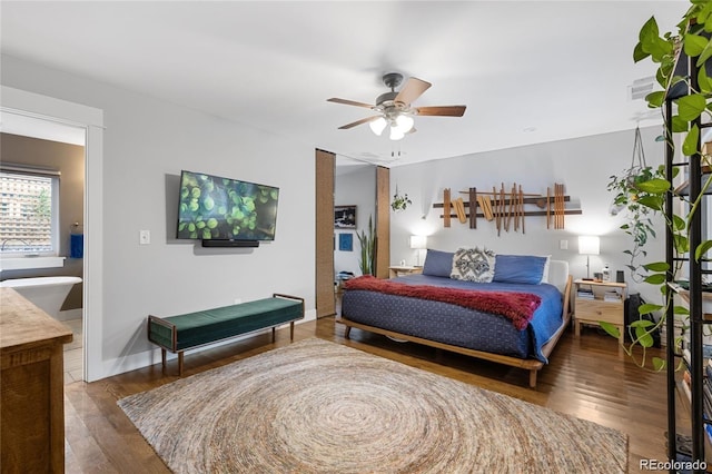 bedroom with ceiling fan and dark hardwood / wood-style flooring