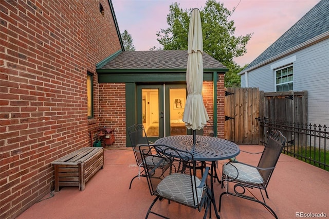 view of patio terrace at dusk