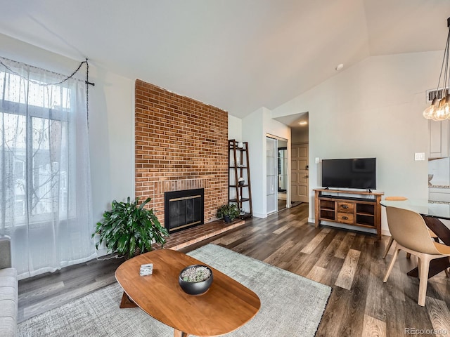 living room featuring a fireplace, dark hardwood / wood-style flooring, and lofted ceiling