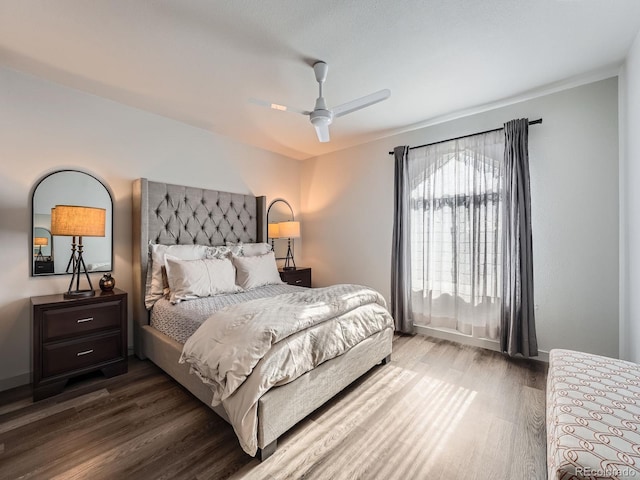 bedroom with hardwood / wood-style flooring and ceiling fan