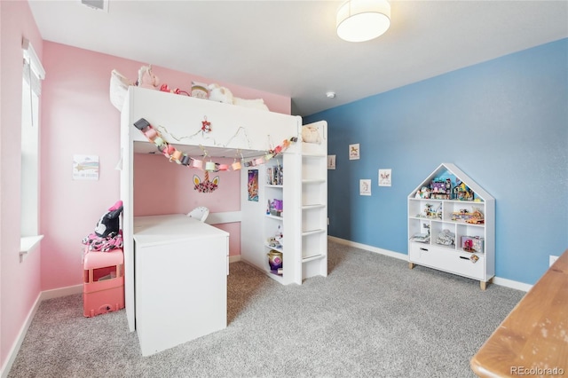 bedroom featuring carpet and baseboards