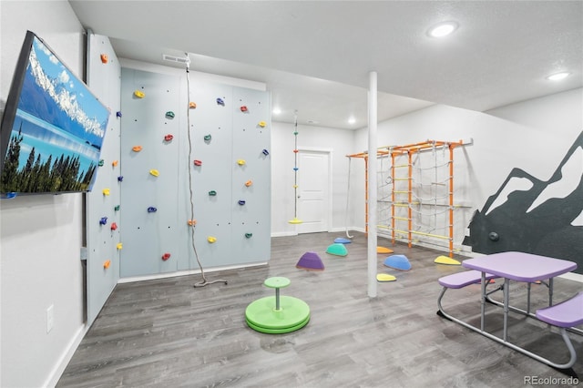 game room featuring recessed lighting, wood finished floors, visible vents, and baseboards